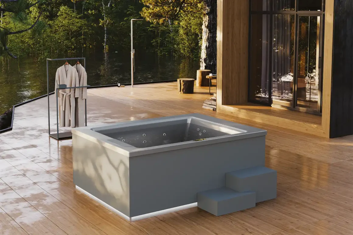 Minipiscine per esterno Helba 210 Disenia freestanding grigia su deck in legno con vista lago e bosco